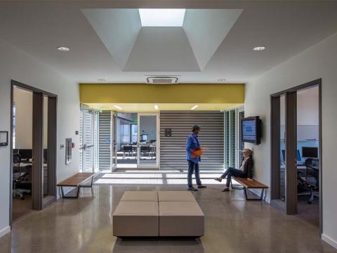 Tulane River and Coastal Center lobby with two people conversing