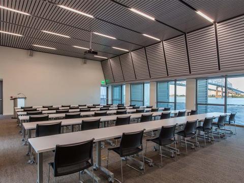 empty forum room with theater style rows of chairs